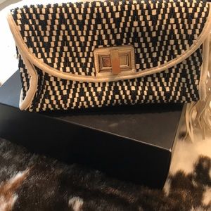 Melie Bianca vegan leather print clutch
